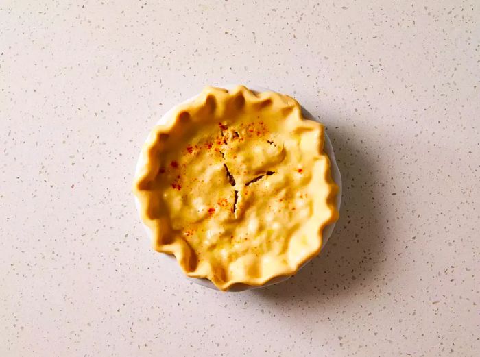 Unbaked Tourtière (French Canadian Meat Pie) in a pie dish