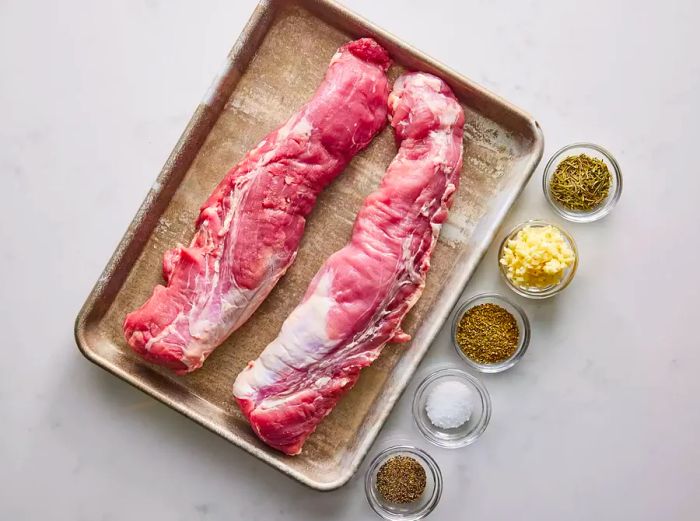 Ingredients for Tuscan Pork Tenderloin laid out on a countertop