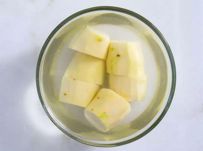 Potatoes soaking in water