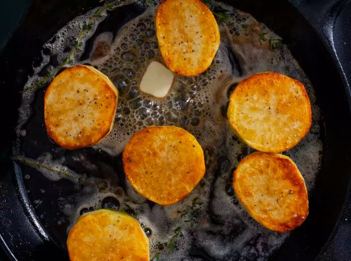 Fondant potatoes coated in butter