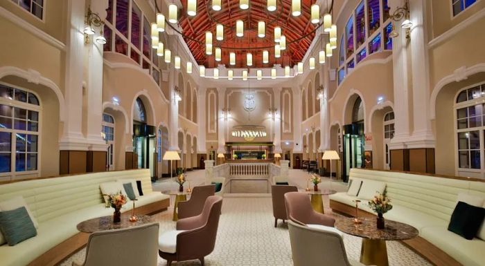 A recent image captures the transformed ticket hall, now serving as the lobby of the hotel.