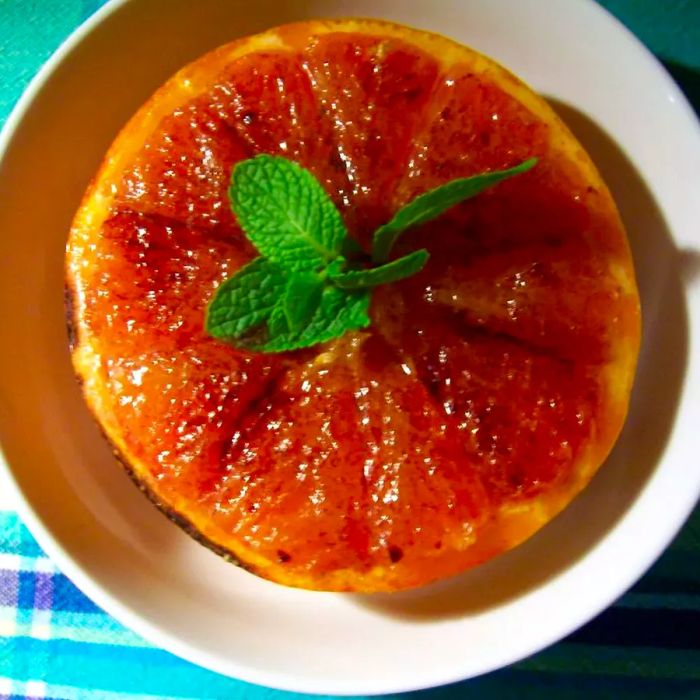 A bowl filled with Broiled Grapefruit