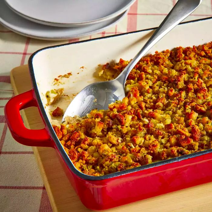 A Rotisserie Chicken and Stuffing Bake served in a red casserole dish