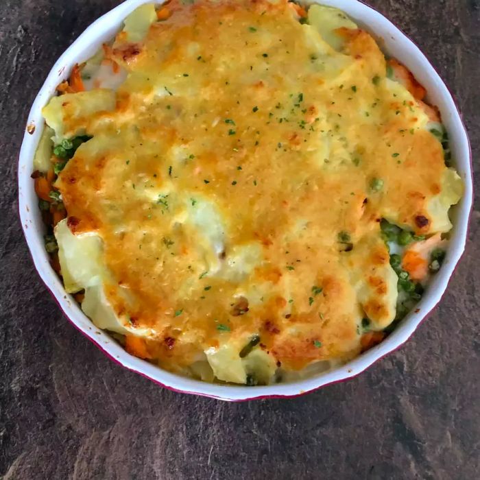 Salmon Casserole Surprise on a wooden background