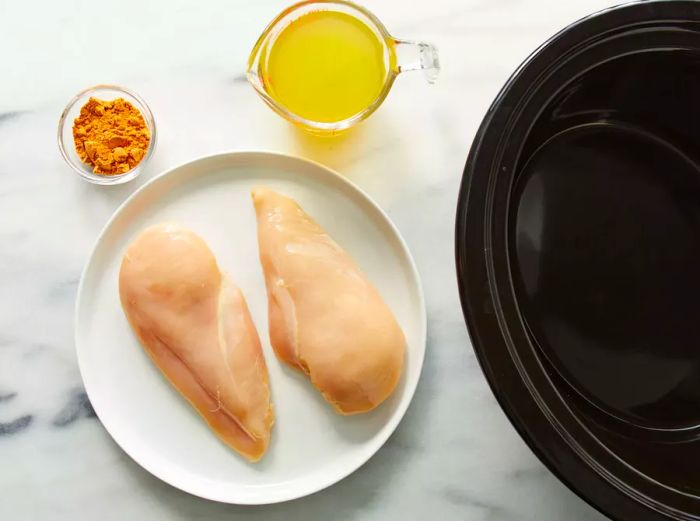 A top-down view of all the ingredients for Slow Cooker Chicken Tacos