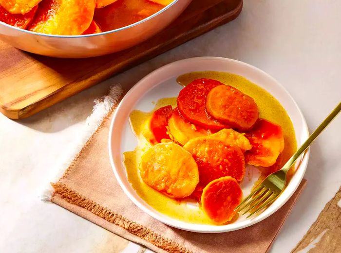A plate of Southern-style candied sweet potatoes, ready to be enjoyed.