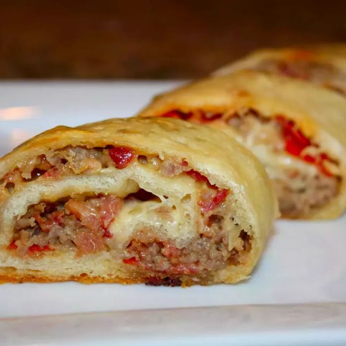 Ham and Cheese Stromboli served on a white plate