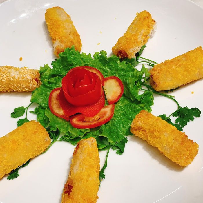 The seafood spring rolls look absolutely irresistible, as shown in the image.