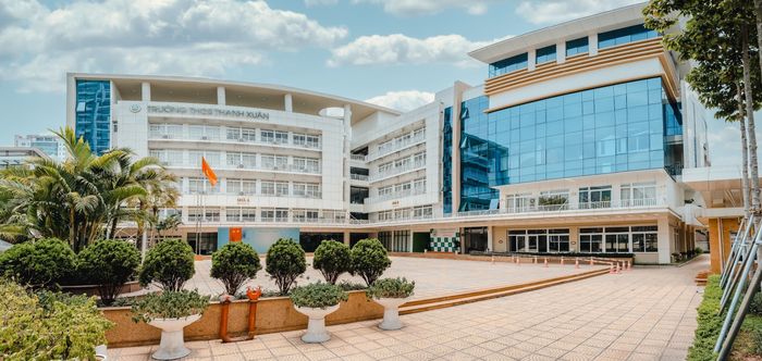 This image captures the lively and vibrant atmosphere of Thanh Xuan Secondary School, where students are engaged in various activities that promote both academic and personal growth.