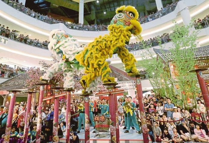 The vibrant Lion and Dragon dance performances during the Malaysian Lunar New Year celebrations are a hallmark of the festivities.