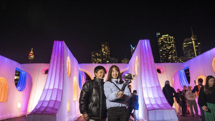 Visitors capturing moments at the Sydney light festival