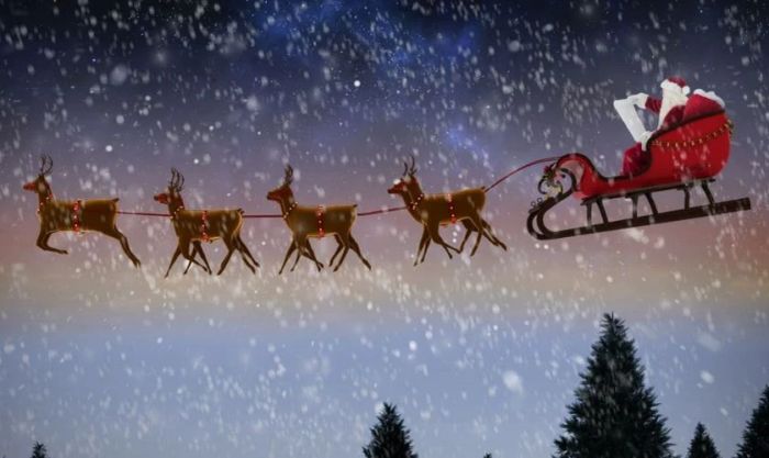 Ông già Noel cùng đàn tuần lộc đang mang quà phát cho mọi người trong đêm tuyết rơi.