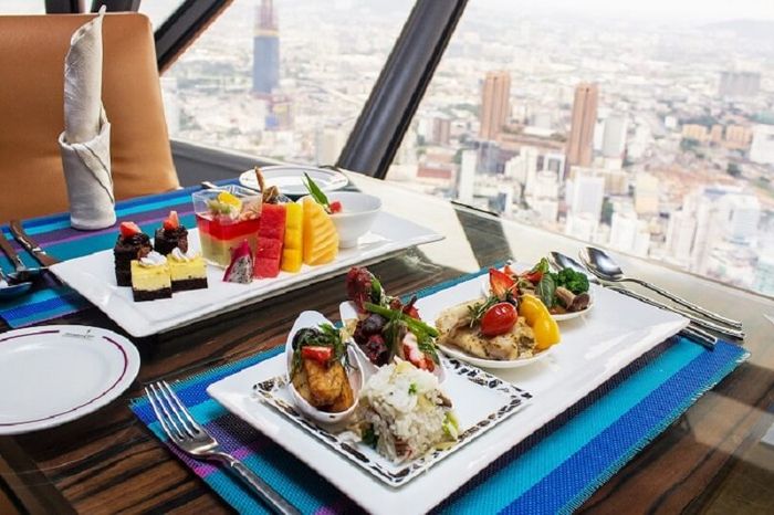 Savor culinary delights at the 360-Degree Revolving Restaurant