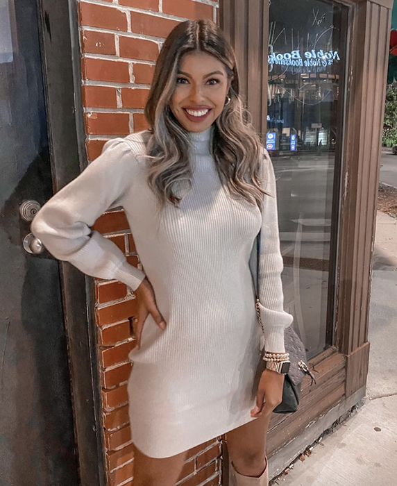 reviewer showcasing the white dress