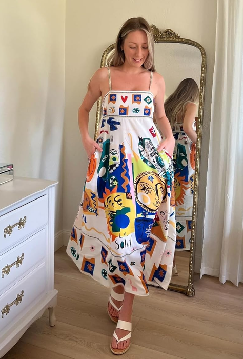 reviewer wearing a maxi dress with abstract prints