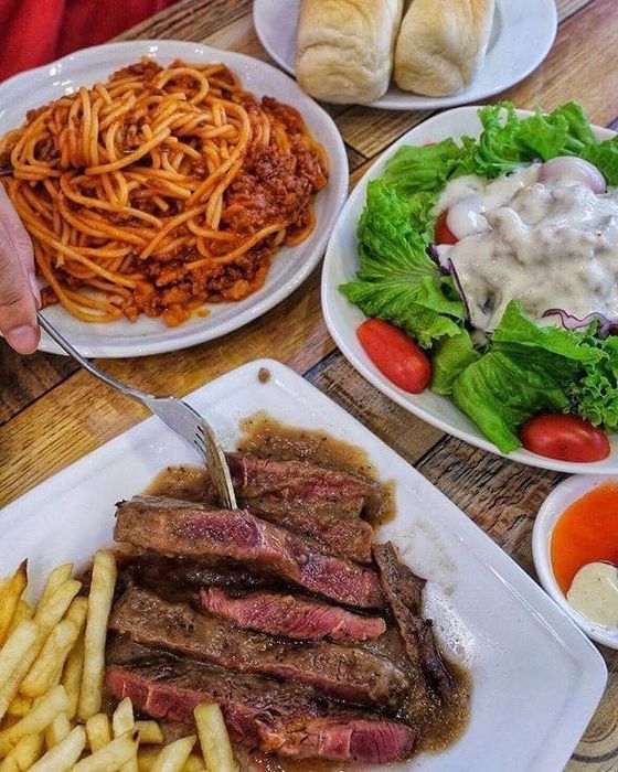 Luna Steak image 2 showcases the restaurant's vibrant atmosphere and beautifully presented dishes, highlighting the skill and creativity that go into each meal.
