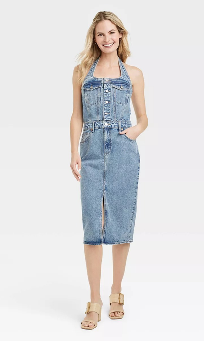 model wearing a blue denim halter dress