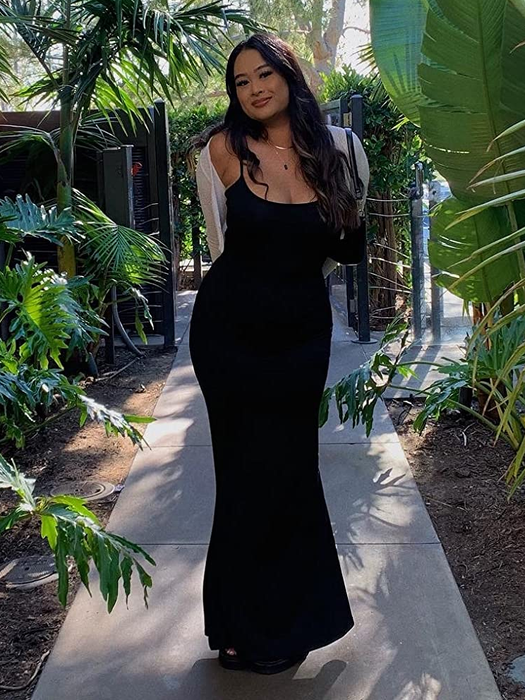 reviewer in a black dress
