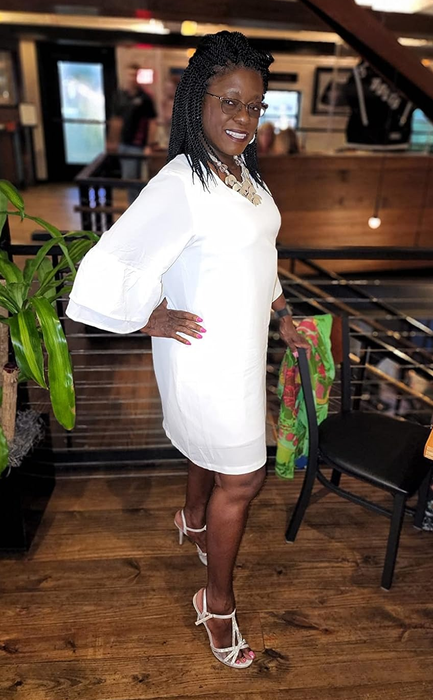 reviewer modeling the white dress