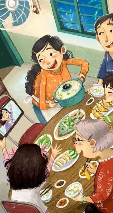 Hình ảnh gia đình quây quần bên mâm cơm ngày Tết