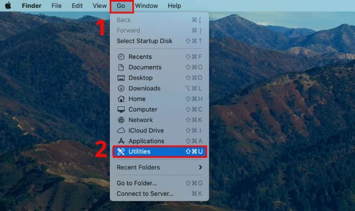 Mở Disk Utility bằng cách vào Go và chọn Utilities.