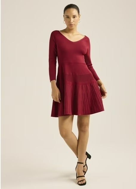 Model showcasing the red dress.
