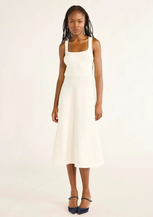 The model is showcasing the stunning vanilla dream white dress.