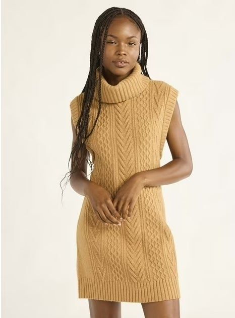 The model is posing in the elegant antelope tan dress.