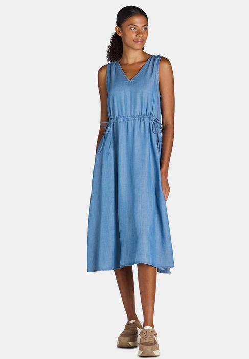 Model showcasing the dress in a medium wash.