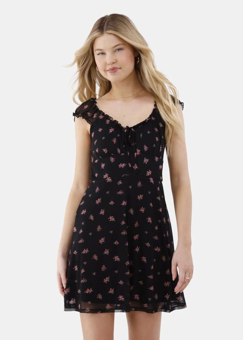 Model showcasing the black floral dress.