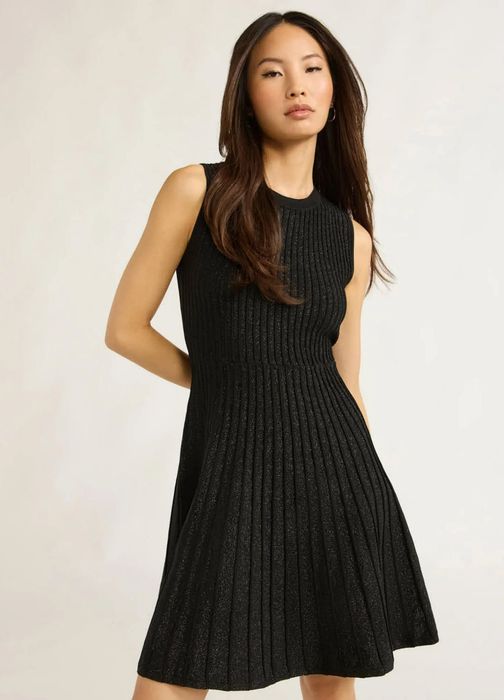 The model is showcasing the stylish black dress.