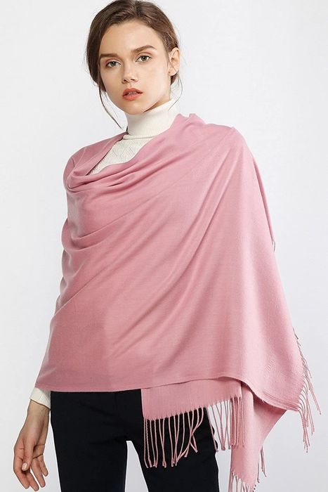 Model wearing the scarf as a shawl, draped gracefully over her chest