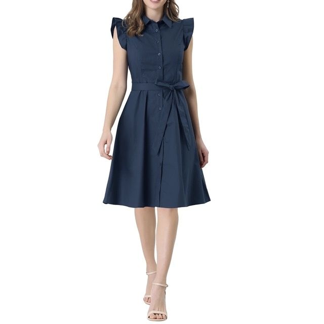 The model is wearing the dress paired with trendy open-toe platform sandals, adding a bit of flair.