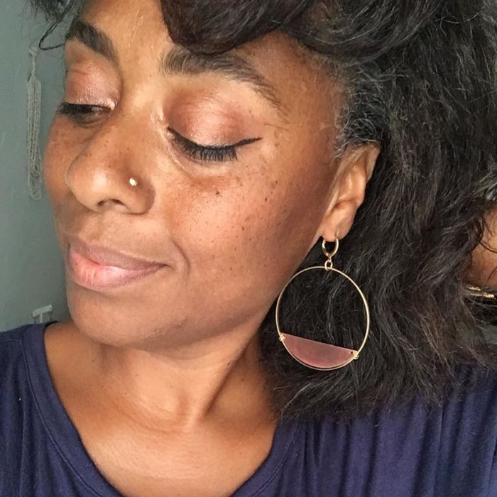 Reviewer showcasing the hoop earrings