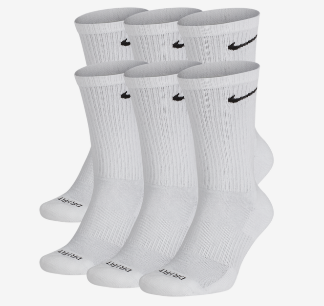 The white socks featuring black Nike swooshes