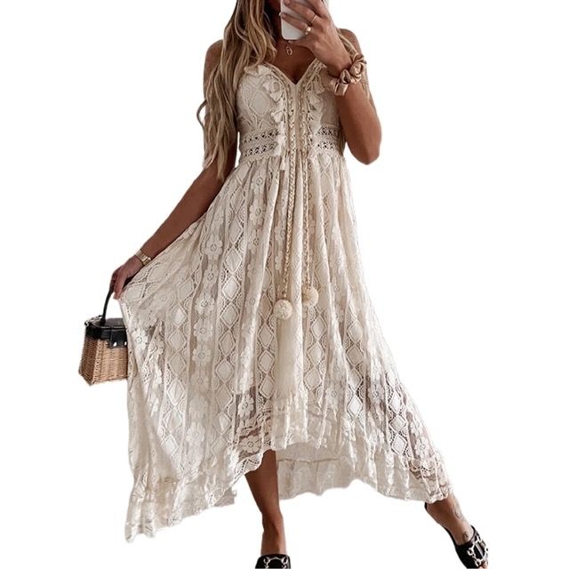 A model wearing the dress, holding a small wicker bag