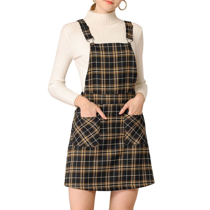 The model is gracefully wearing the dress, showcasing its elegant fit.