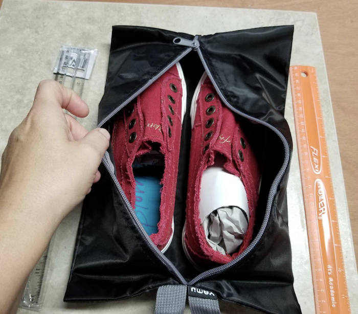A reviewer’s sneakers neatly stored inside the travel bag