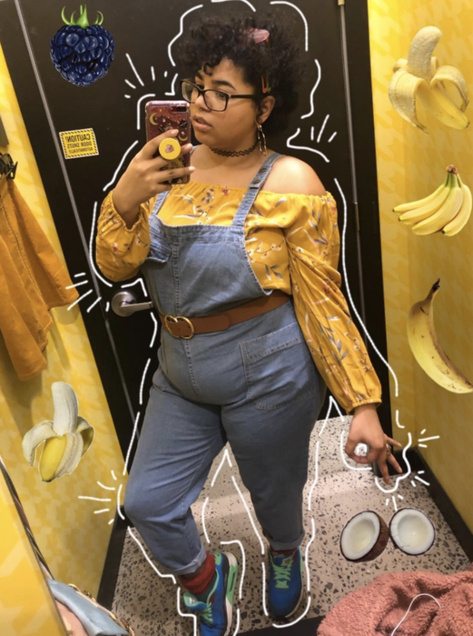 Reviewer wears the same overalls with a yellow off-shoulder blouse and colorful sneakers