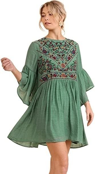 model wearing the green version of the dress