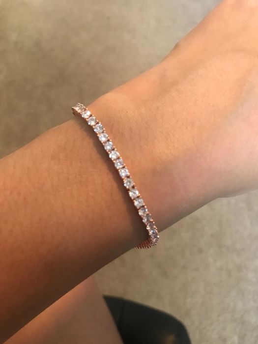 Reviewer photo showing a detailed view of the rose gold tennis bracelet