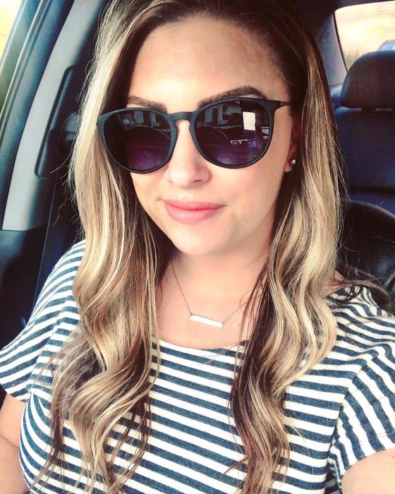 Reviewer wearing black matte sunglasses