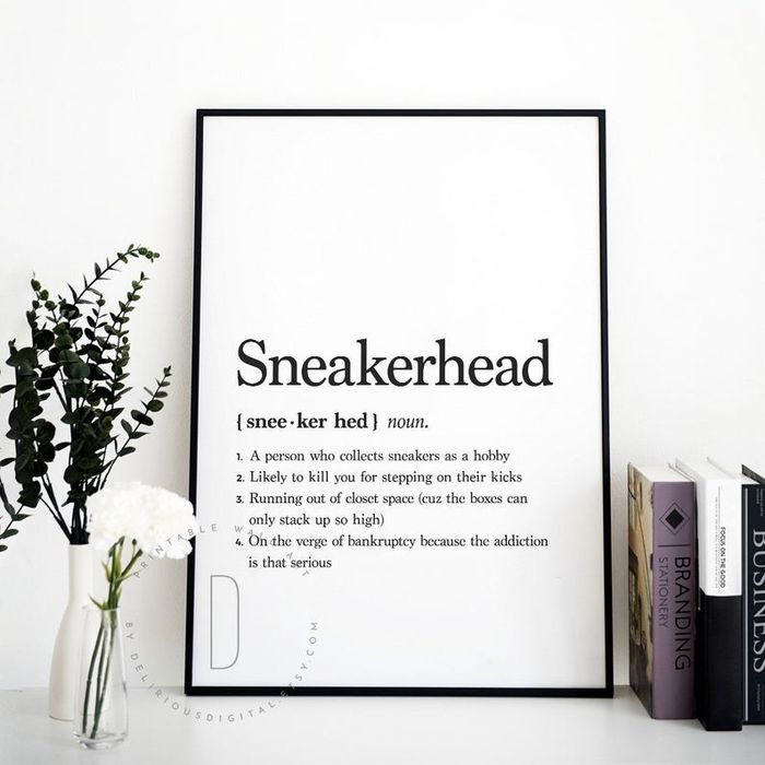 A framed white print featuring the definition of a sneakerhead in bold black text