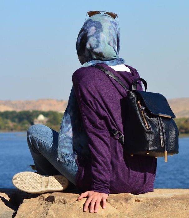 Reviewer wearing the black backpack outdoors