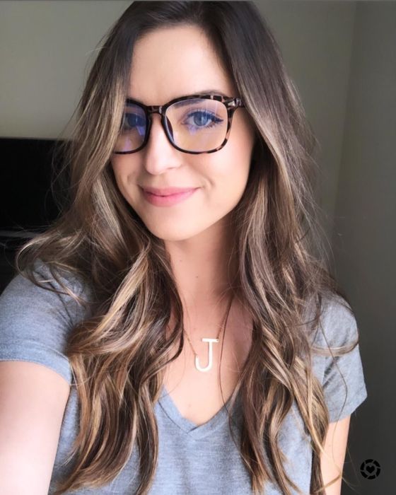 Reviewer showcasing leopard-print blue light blocking glasses