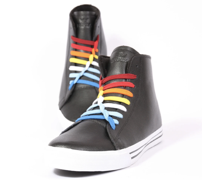 A pair of sneakers featuring vibrant rainbow U-laces
