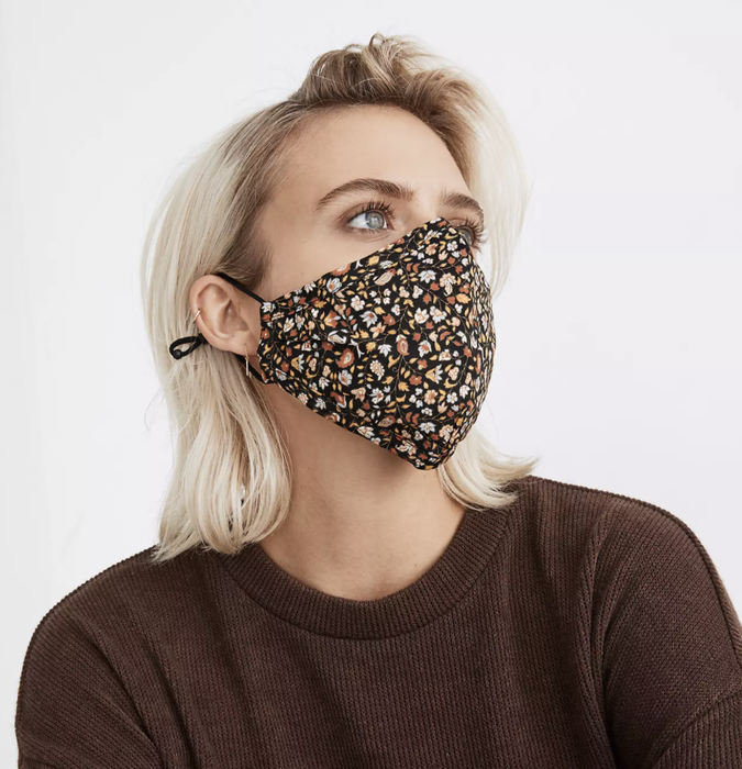 Model wearing a floral-printed face mask