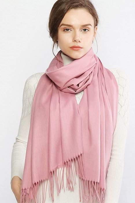 Model styling the scarf around her neck