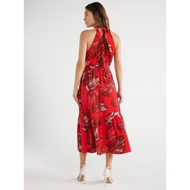 The model is seen from behind, highlighting the dress she’s wearing.