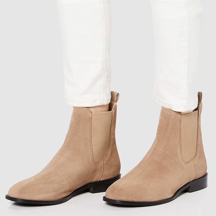 A model wearing the taupe shoes